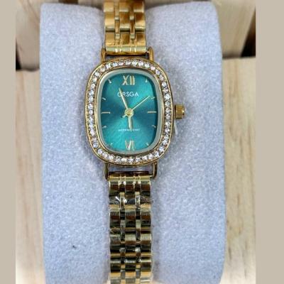  ORSGA 856 - Montre Femme Dore-Vert Quartz Boîtier Ovale Lunette Strass